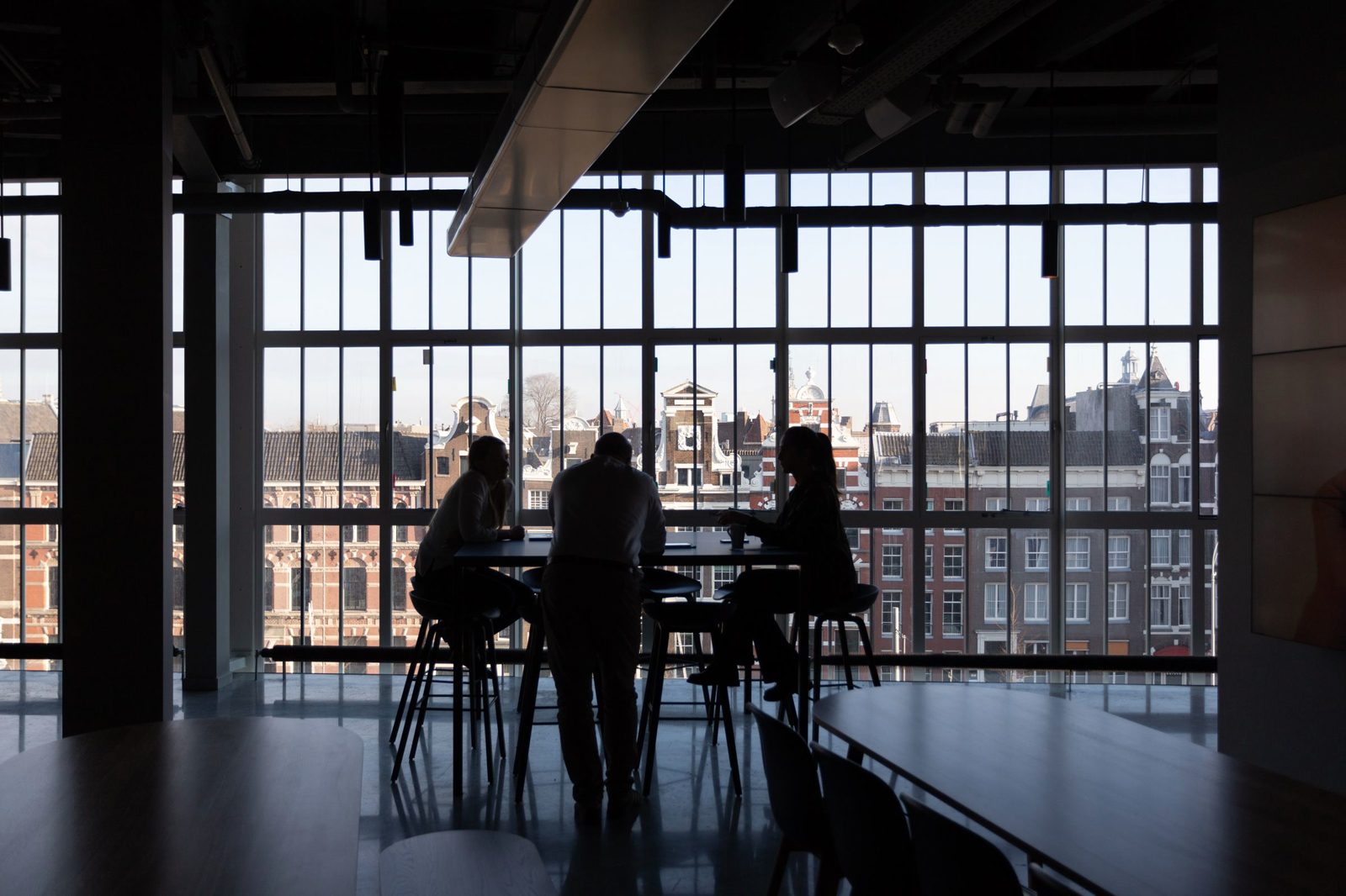 Certification team meeting with a client in a boardroom