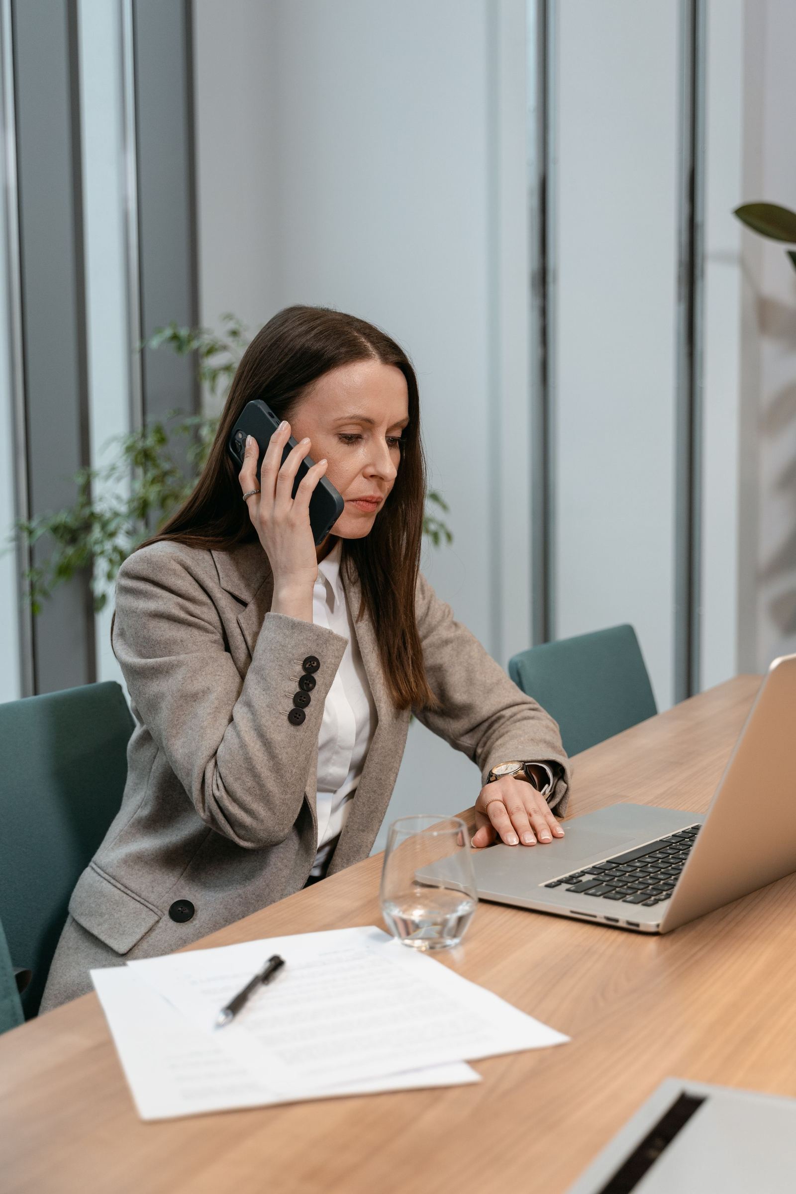 Practice staff member taking a phone call at a desk
